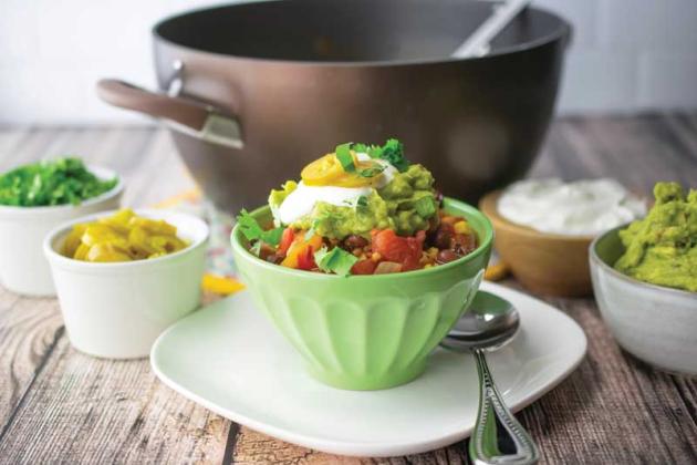 Guacamole, sour cream, jalapenos and cilantro are optional additions to bump your chipotle veggie chili up a notch.