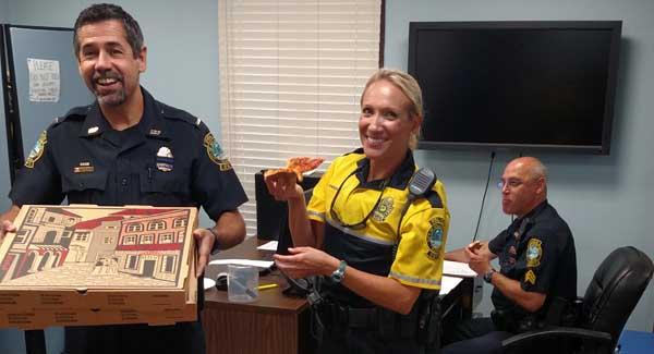 Atlantic Beach police enjoy pizza delivered to the department July 13 to show appreciation for police efforts in the community. From left are Dale Hatfield, Tricia Anderson and Paul Diakos. (photo submitted)